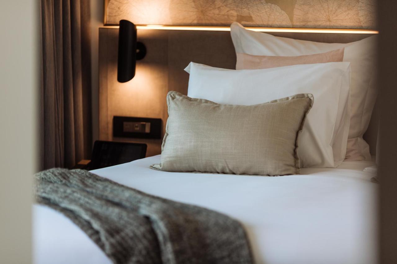 One Global Resorts Green Square Sydney Exterior photo A bed with a throw