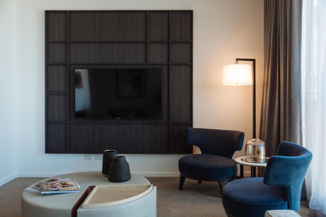 One Global Resorts Green Square Sydney Exterior photo A television set in a hotel room